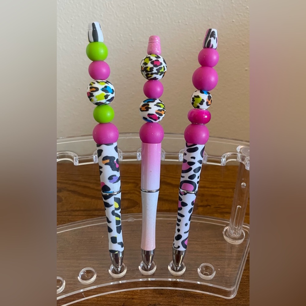 Hand beaded wild animal print pens.